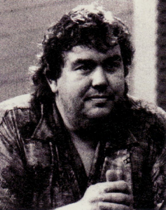 The rugged look of John Candy.